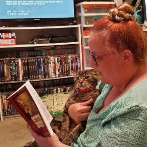AmyBeth reading FOR LOVE OF THEIR CHILDREN to Simon.