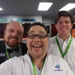 Sparkman with Travis Schenck (left) Director of Space Foundation's Discovery Center, and fellow volunteer Kyle Nachbar (right)